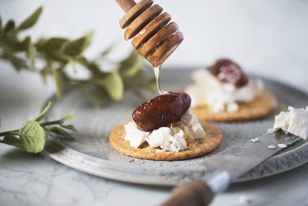 Chaeban soft feta cheese on cracker with dates